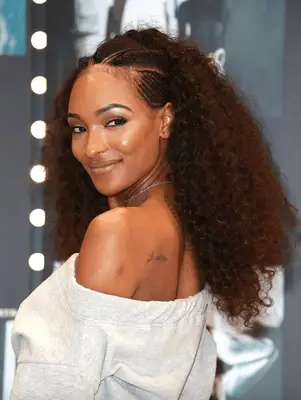 Woman with Afro hairstyle and colorful makeup look