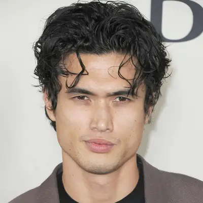 Charles Melton with longer on top short on sides quiff