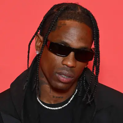 Travis Scott braids haircut longer on top short on sides