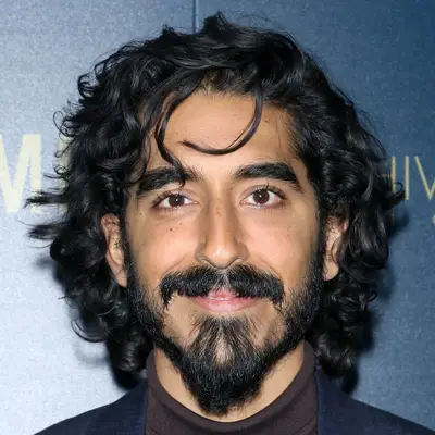 Dev Patel with curly shag