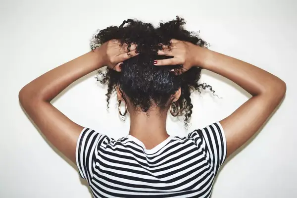 woman touching hair
