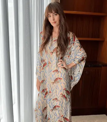 Dakota Johnson attends a Beverly Hills event with a long highlighted bob and curtain-styled fringe