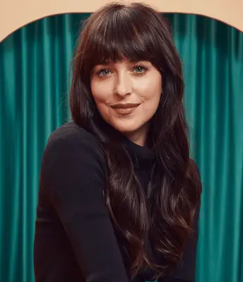 Close up of Dakota Johnson with fringe and straight hair