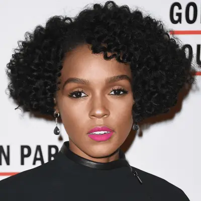 janelle monae wearing a curly bob
