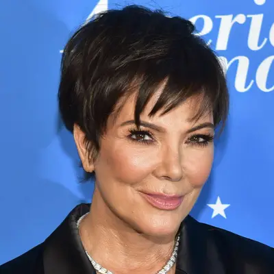 Kris Jenner attends a film premiere in LA with her choppy textured pixie and wispy side swept bangs