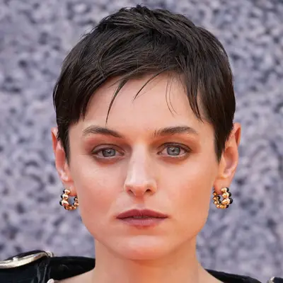 Emma Corrin wears a wispy textured pixie and smokey eye to film event in London