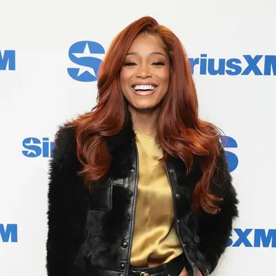 Keke Palmer with mahogany caramel hair color 