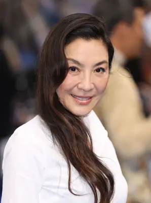 Michelle Yeoh long, sideswept wavy hair 