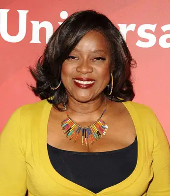 Loretta Devine lob with side-swept bangs and flipped-out ends