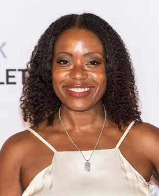 Tracy Reese natural hair with middle part