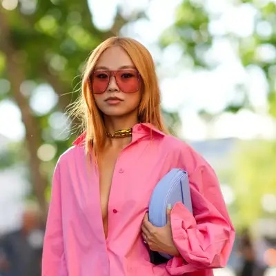 woman with straight strawberry blonde middle part hair
