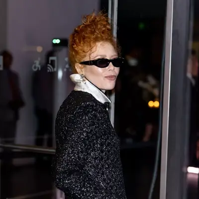 Natasha Lyonne with curly strawberry blonde updo hair