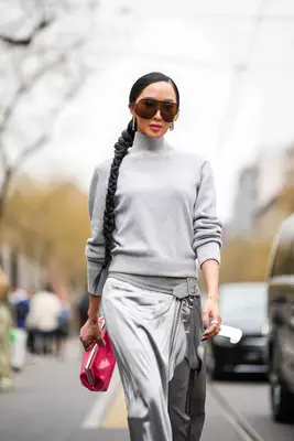 Chriselle Lim wearing a long braided ponytail at the Fendi Fall/Winter 2023/2024 runway show in Milan, Italy 