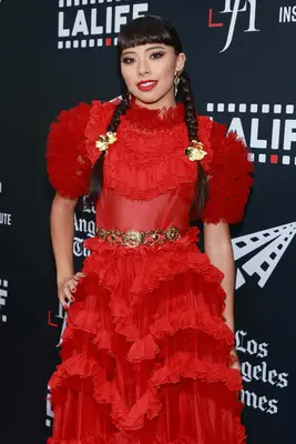 Xochitl Gomez wearing pigtail braids with gold flower pins at the 2023 Latino Film Festival in Los Angeles