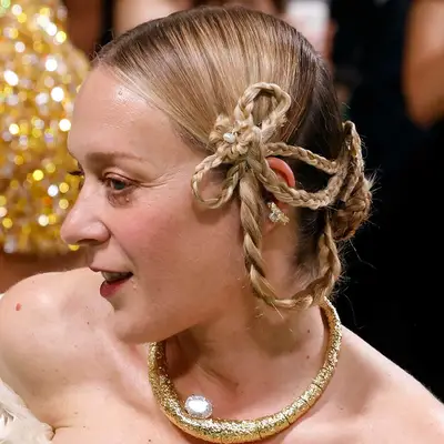 Chloë Sevigny with a braided blonde bow hairstyle at the 2024 Met Gala in New York City
