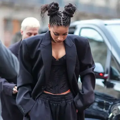 Willow Smith with box braids tied into two high buns at the Vetements Fall/Winter 2024/2025 runway show in Paris, France