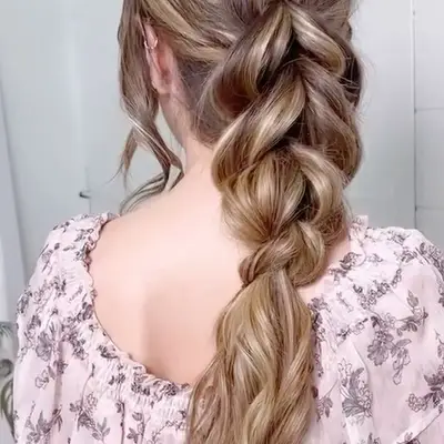 A woman with a pull-through braid hairstyle