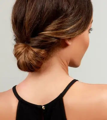 A model with a simple, chic chignon hairstyle