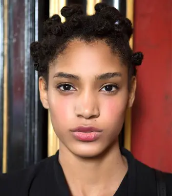 A model wearing bantu knots