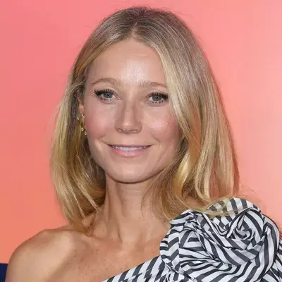 Gwyneth Paltrow with center-parted hair and glowy makeup at the Veuve Clicquot Celebrates 250th Anniversary With Solaire Exhibition
