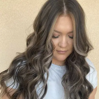 Woman with face-framing ash blonde highlights