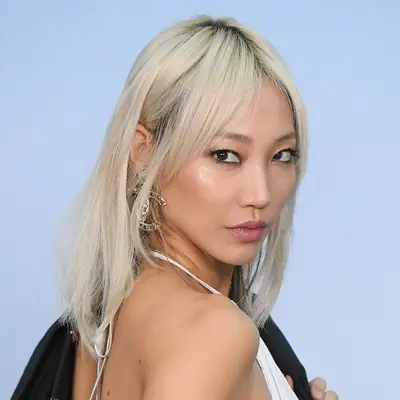 Soo Joo Park wears platinum ash blonde hair with curtain bangs