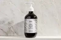 A bottle of the BondiBoost HG Shampoo for Thinning Hair