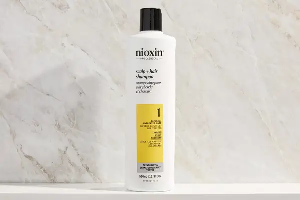 A bottle of the Nioxin System 1 Shampoo