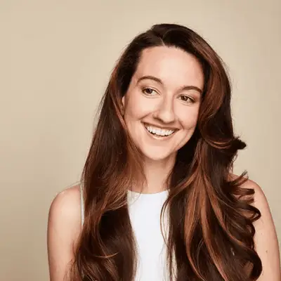 Woman with brunette hair and curls