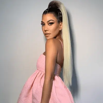 Kristina Rodulfo wears a high bun with tiara and headphones like Mia Thermopolis in The Princess Diaries