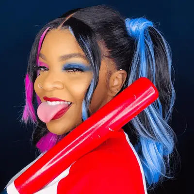 Woman with Harley Quinn-inspired high pigtails with blue and pink streaks