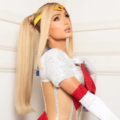 Paris Hilton as Sailor Moon, with two, blonde high ponytails and side bangs.