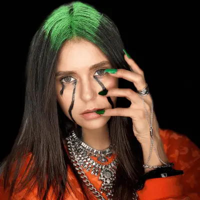 Billie Eilish halloween costume with lime green t-shirt and black space buns with green roots.