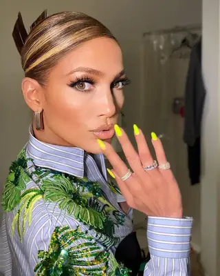Jennifer Lopez with chunky highlights and updo