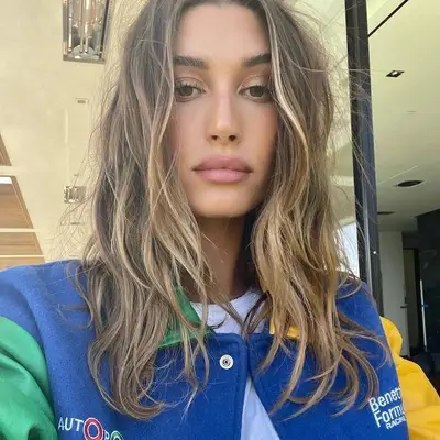 Hailey Bieber with dimensional dirty blonde highlights
