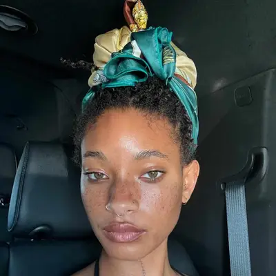 Willow Smith wears her hair in a colorful silk scarf