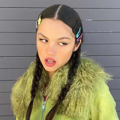 Olivia Rodrigo wears two braided pigtails with barettes