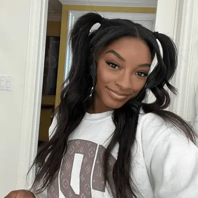 Sofia Richie Grainge poses with a polished top knot bun