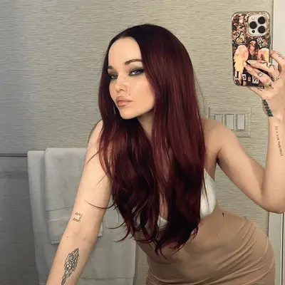 Dua Lipa with black cherry hair