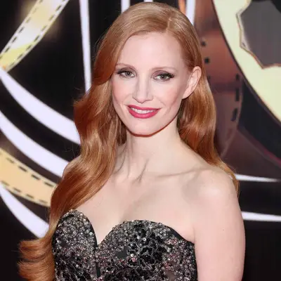 Jessica Chastain with long soft curls and side part at the 20th Marrakech International Film Festival