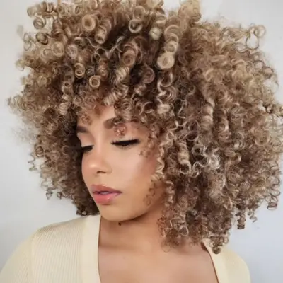 Tortoise-shell blonde balayage on a natural afro