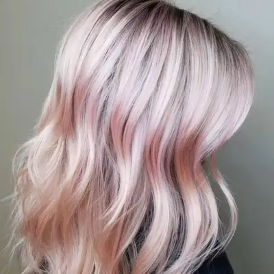 Baby pink highlights on blonde hair
