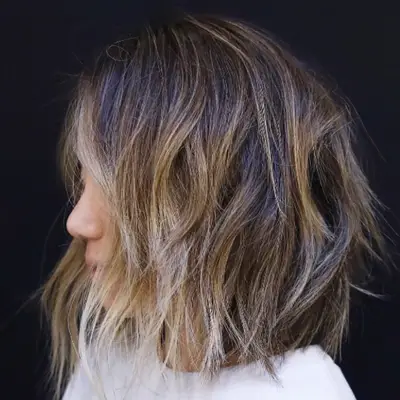 Lived-in brown balayage hair with a lob cut