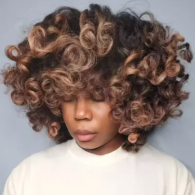 Blogger Aimee Song looks at the camera with a short balyage bob 