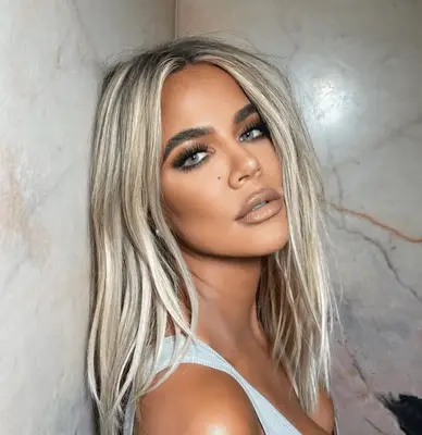 Khloe Kardashian with mid-length bright white highlights