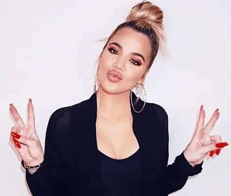 Khloe Kardashian wearing a high ballerina bun