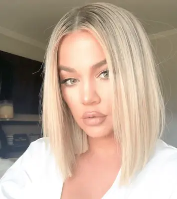 Khloe Kardashian in a center part a-line lob