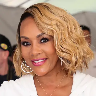 Vivica A. Fox wears a layered, wavy bob with a side part