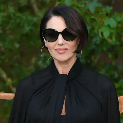 Monica Bellucci wears a bob hairstyle with a deep side part