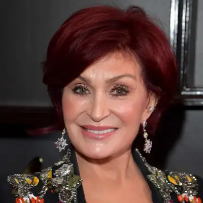 Sharon Osbourne wears a short, bright red hairstyle with a rounded blowout